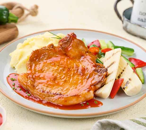 Chuletina con salsa agridulce y palmitos grillados
